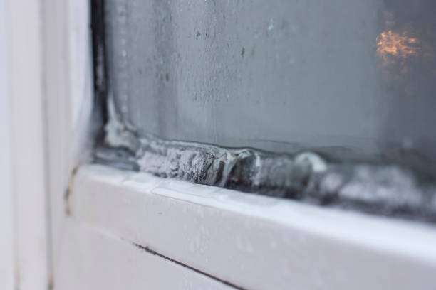istock the problem of freezing of plastic Windows in the winter time, the front and background blurred with the bokeh effect 1180573247