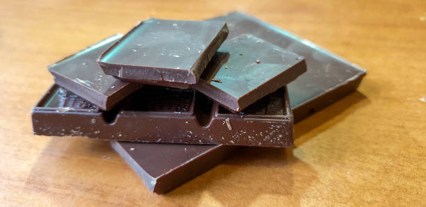 istock Chocolate close-up. Pieces of chocolate on the table. 1180574392