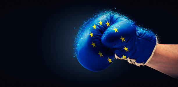istock Europe and UK  flaged boxe gloves with arm 1180575320