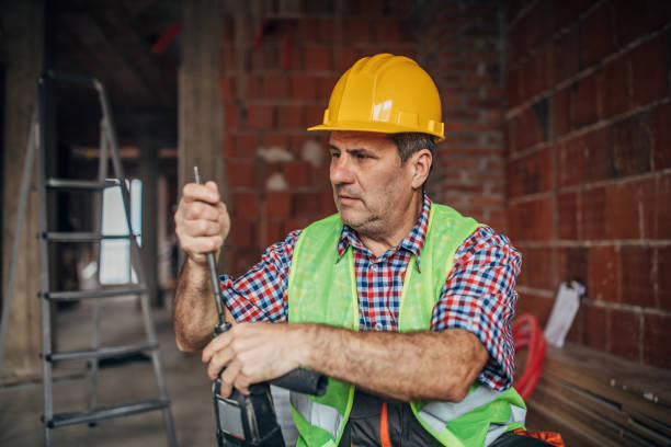 istock An old construction worker is getting ready for the job 1180579788