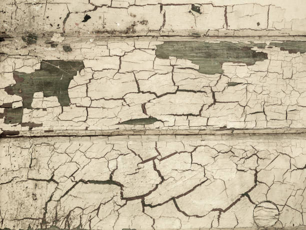 Paint peels off on a old wooden wall