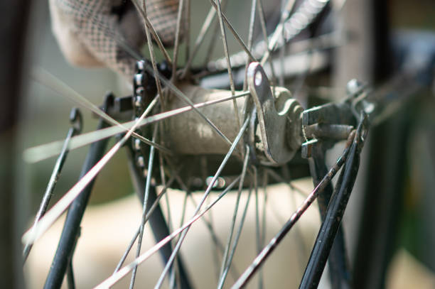 istock Hobby mechanic in overall repairs a bicycle 1180582185