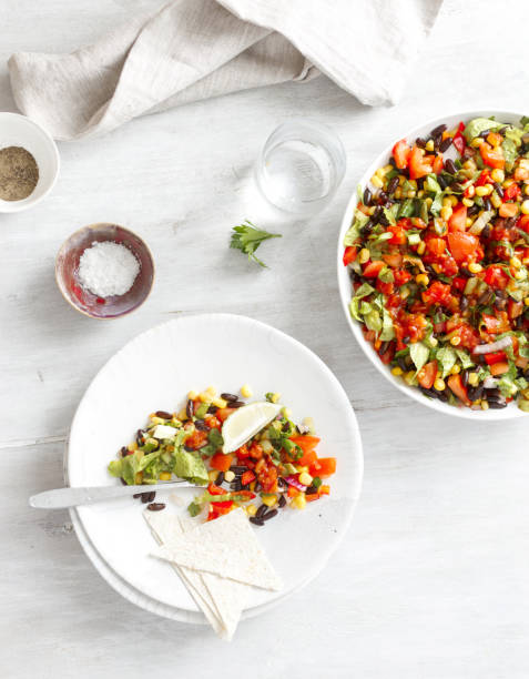 istock Mexican taco salad in plates on light wooden table top view 1180583015