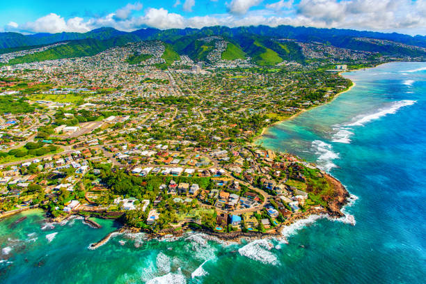 Suburban Honolulu From Above The suburban residential districts of Honolulu, Hawaii along the coastline just outside of downtown from about 1000 feet over the Pacific Ocean. oahu stock pictures, royalty-free photos & images