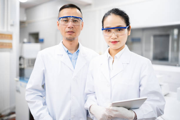 istock Two Asian scientists in a medical laboratory 1180583391