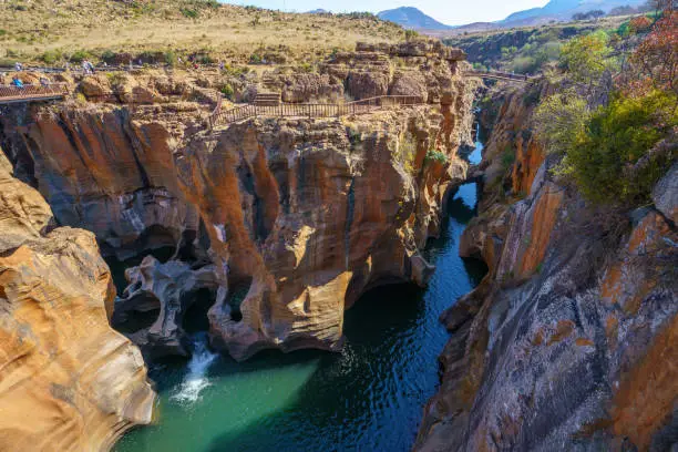 steep walls of red sandstone at bourkes luck potholes, mpumalanga, blyde river canyon, south africa