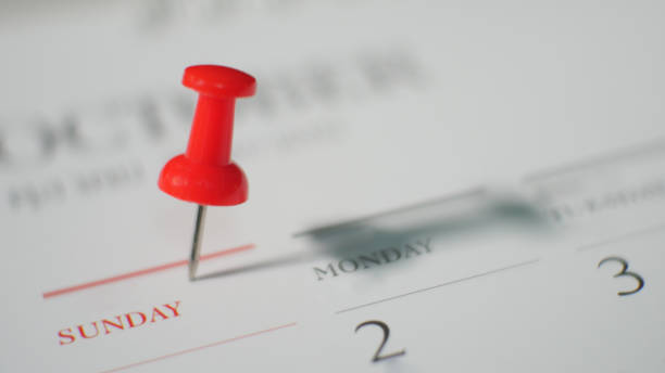istock Close  up red pin marked on calendar in planning concept. 1180589973