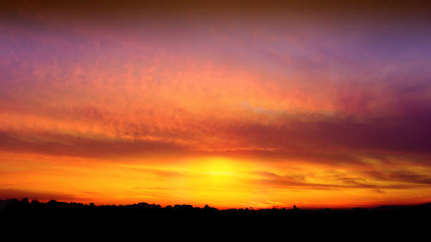 istock Sunrise sky background over the field 1180594081