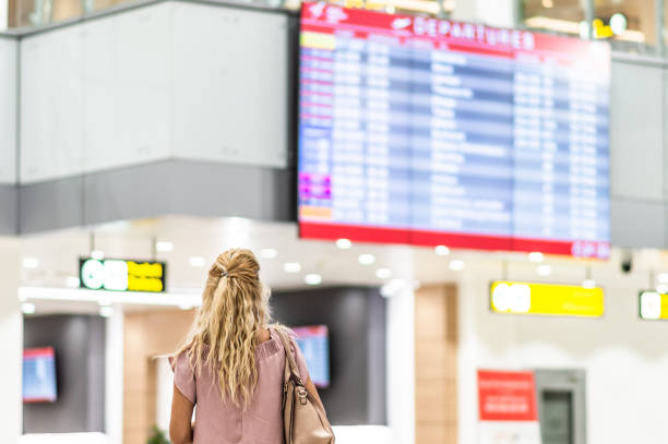 istock Checking the schedule at the airport 1180596124