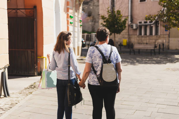 istock Happy mother and daughter shopping 1180596222