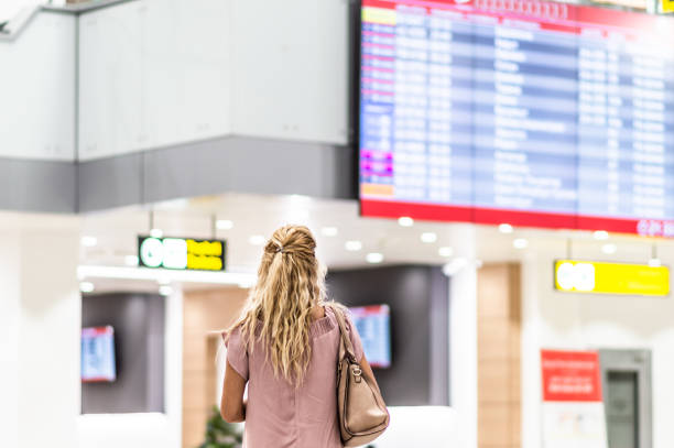 istock Checking the schedule at the airport 1180596248