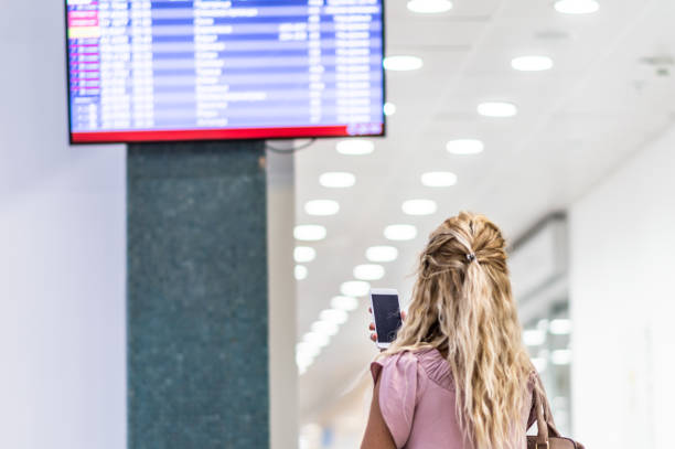 istock Checking the schedule at the airport 1180596385