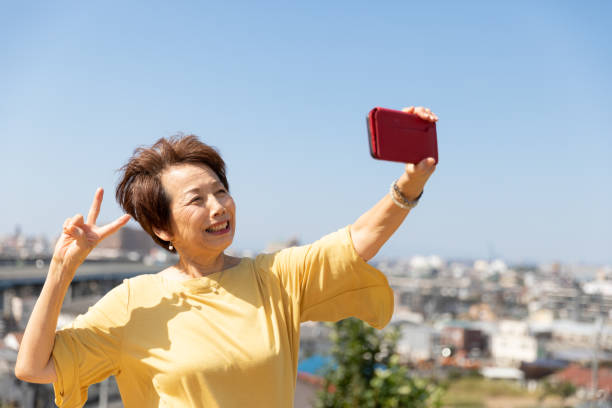 istock Senior woman taking selfie 1180599082