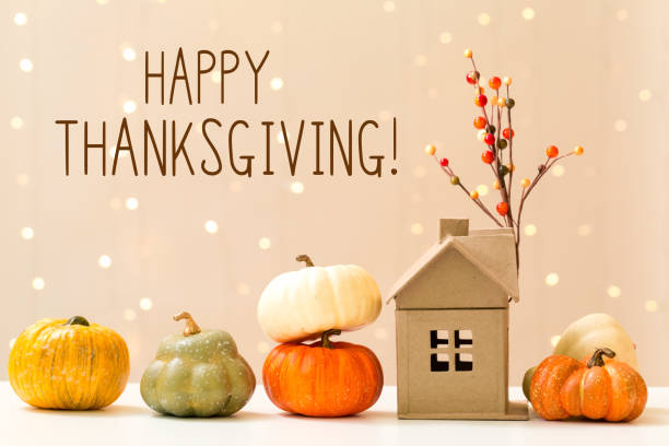 Thanksgiving message with pumpkins with a house