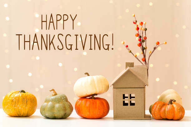 Thanksgiving message with pumpkins with a house stock photo