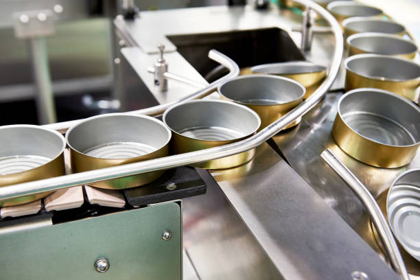 istock Empty cans on conveyor of food factory 1180603269