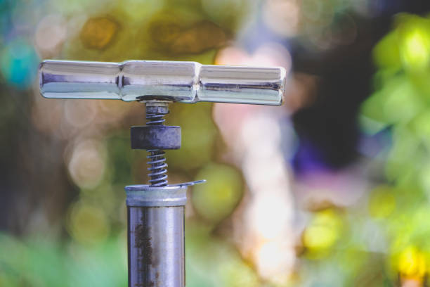Vintage Air pump for bicycle on nature background.