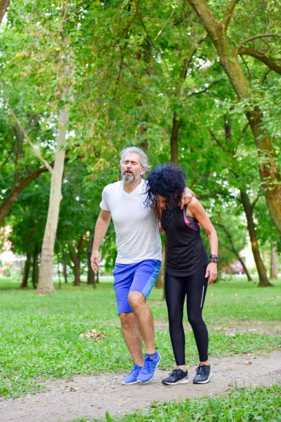 istock Middle-aged man injured his leg while jogging 1180604559