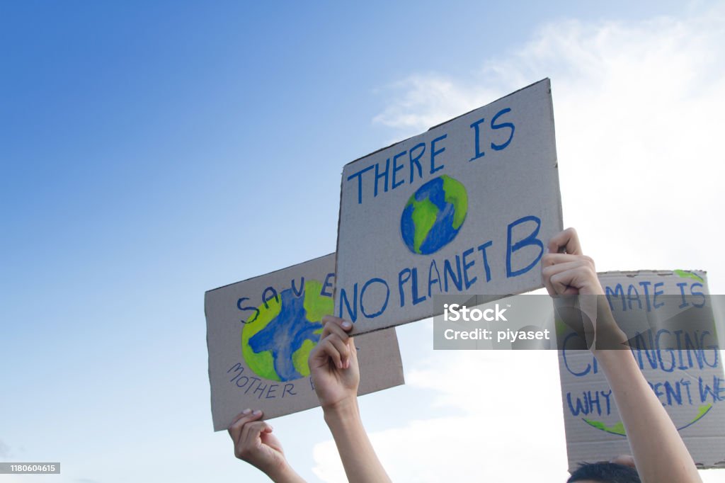 Global warming and climate change concept. Group people of demonstration making protest about climate change, plastic pollution and forest fire for environmental problem Climate Stock Photo