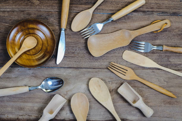istock wooden surface and a wooden spoon and fork on wood table. 1180604693