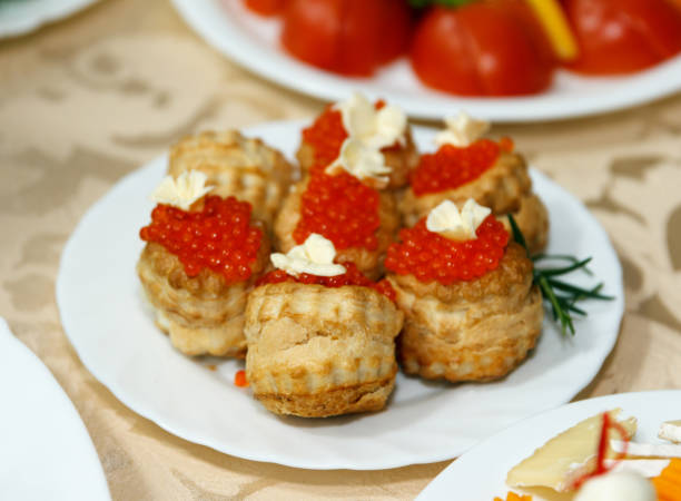 istock Buns with red caviar and butter in a plate 1180605560