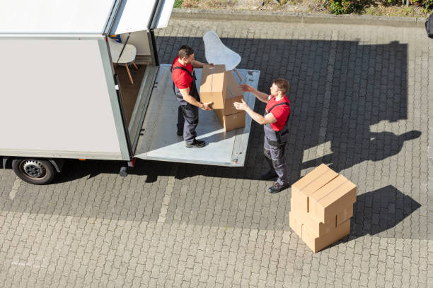 istock Male Movers Unloading The Cardboard Boxes Form Truck 1180605655