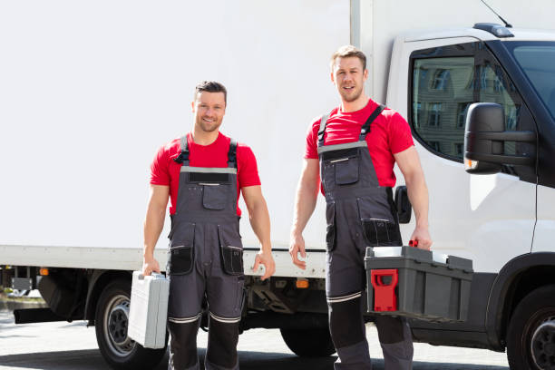 istock Portrait Of A Smiling Young Male Technicians Holding Tool Box 1180605669