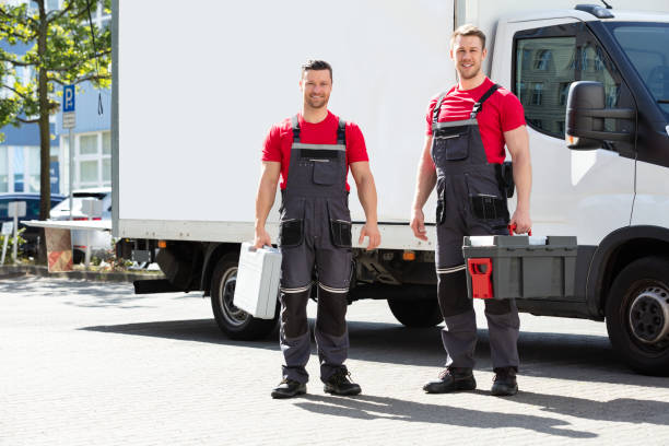 istock Portrait Of A Smiling Young Male Technicians Holding Tool Box 1180605684