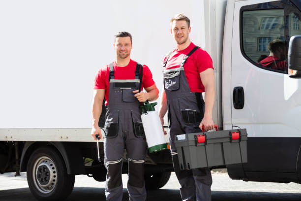 istock Portrait Of A Smiling Young Male Technicians Holding Tool Box 1180605702