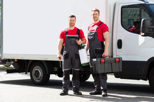 istock Portrait Of A Smiling Young Male Technicians Holding Tool Box 1180605753