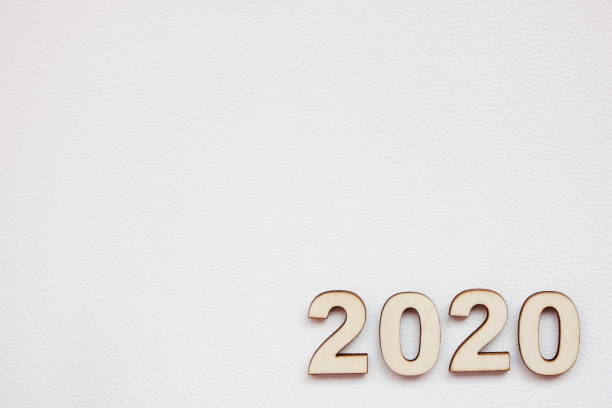 istock 2020 new year's number is lined with wooden numbers on a white background. 1180607412