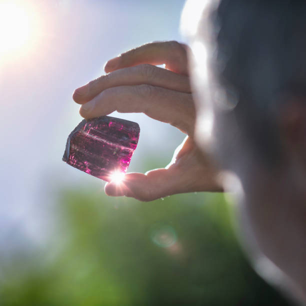 istock Crystal Healing Therapy with Purple Amethystine Quartz Crystal 1180607542