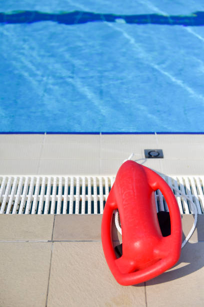 istock Life guard rescue buoy at the pool 1180607723