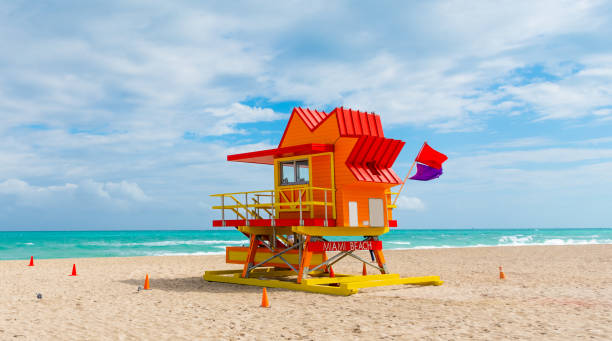 istock Colorful lifeguard tower under a cloudy sky in Miami Beach, 1180608433