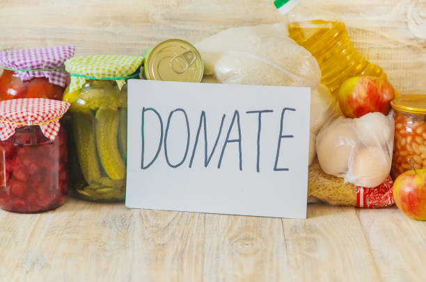 istock Food and plate with text for donation. Selective focus. 1180610102