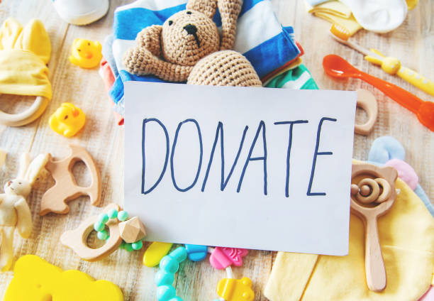 istock Baby clothing and donation accessories. Selective focus. 1180610263
