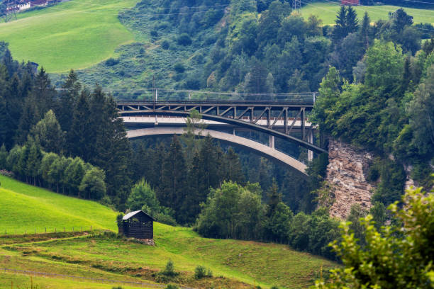 istock A picturesque Alpine landscape with an old railway bridge. Austria. 1180610695