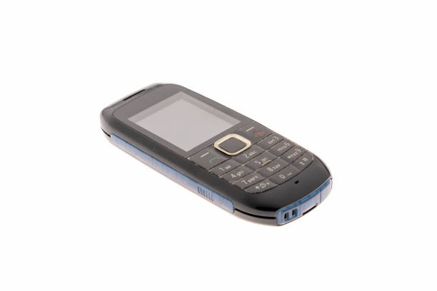istock Old vintage mobile phone with buttons on a white background. 1180611959