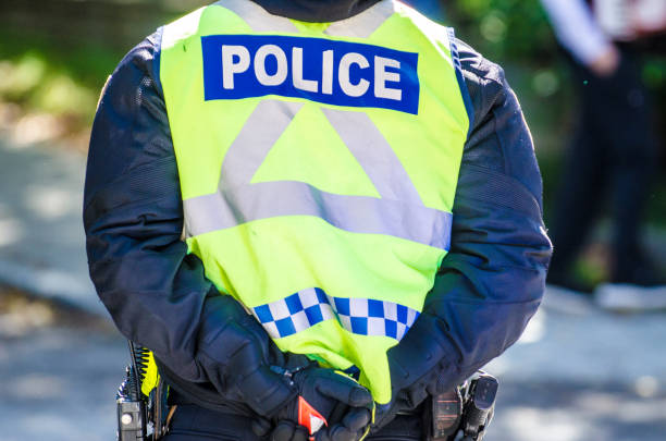 Back of police officer stock photo