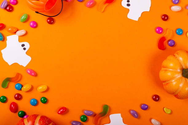 istock Halloween and decoration concept. Collection of Halloween party objects forming a frame 1180615141