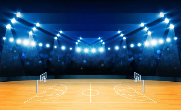 istock Basketball arena field with bright stadium lights design. 1180619450