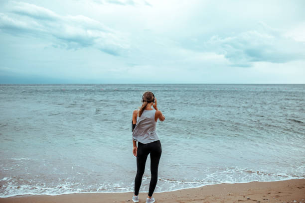 istock Beautiful woman jogging 1180620843