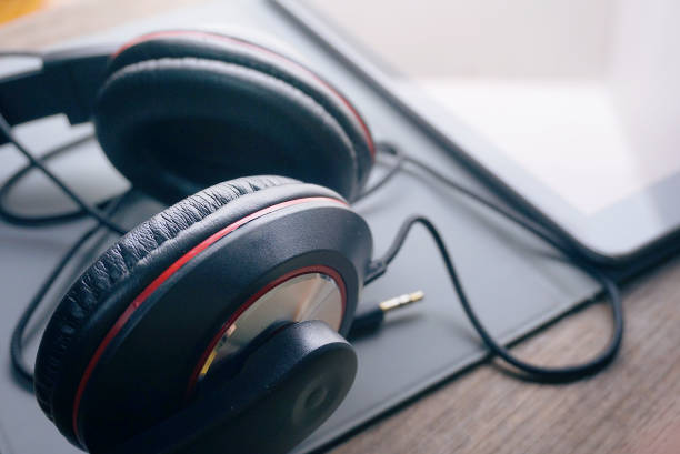 istock Headphone and tablet on wood table,lifestyle concept. 1180621706