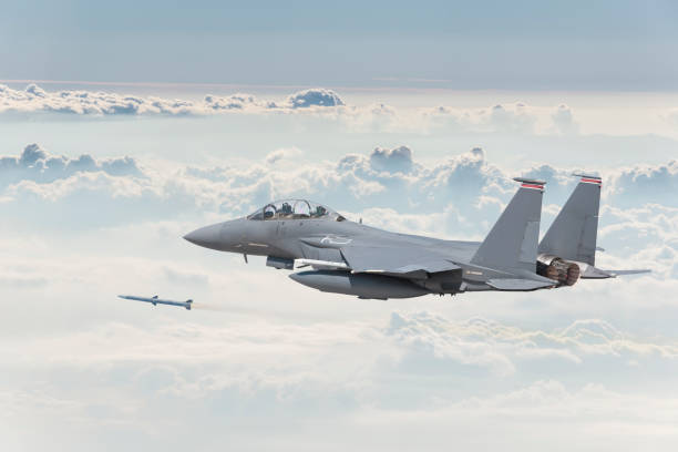 istock F-15 Strike Eagle Fighter Plane firing missile 1180622812