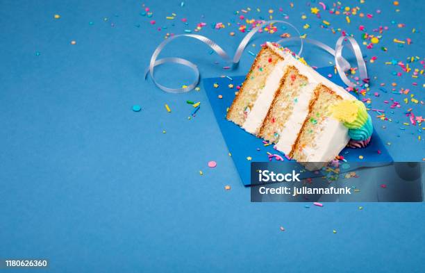 Slice Of Birthday Cake On Blue Stock Photo - Download Image Now - Birthday Cake, Slice of Food, Blue