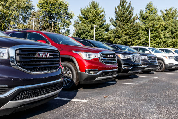 gmc suv display at a buick gmc dealership. gmc focuses on upscale trucks and utility vehicles and is a division of gm - truck military armed forces pick up truck imagens e fotografias de stock