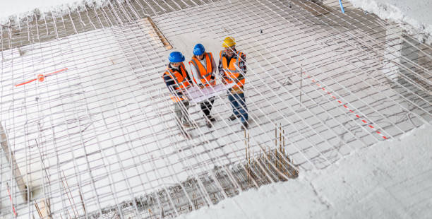 istock Building Contractors And Investor Discussing Construction Plans 1180627378