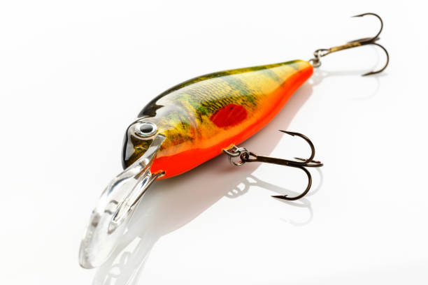 Fishing bait tackle and baubles for fishing on a white background Fishing bait tackle and baubles for fishing on a white background, wobbler. minnow fish photos stock pictures, royalty-free photos & images