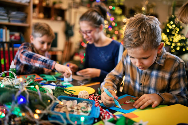 istock Family crafting Christmas cards 1180632745