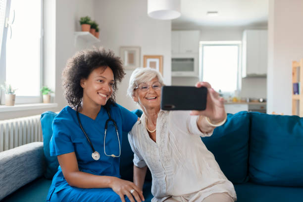 istock Nurse and Elderly Patient Taking a Selfie 1180633925